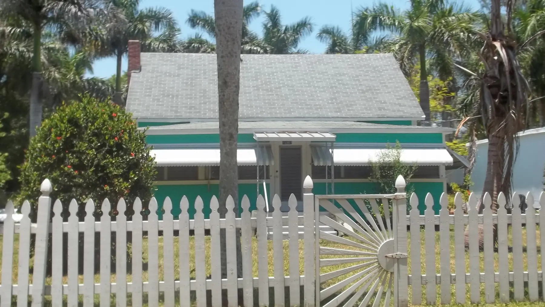 A frame cottage behind a picket fence in the Cortez historic district.